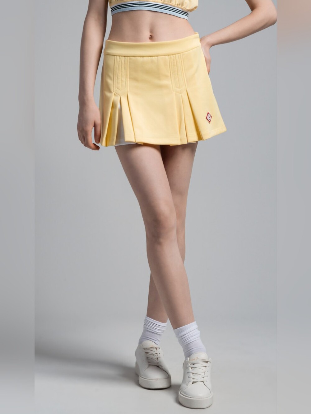 Casablanca Box Pleat Skirt in pastel yellow. Size medium